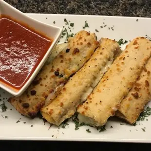 One of our appetizers! Breadsticks with marinara sauce!