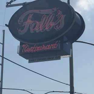 a neon sign for a restaurant