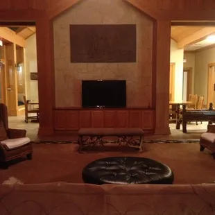 A grand fireplace sits opposite the larger than life TV in the great room. We love to gather here before meals and outings.