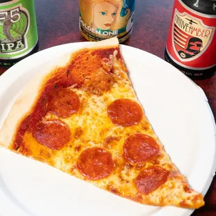 a slice of pepperoni pizza on a plate