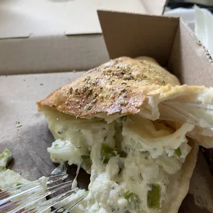 a half eaten pizza in a box