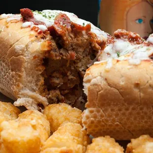 a sandwich and tater tots