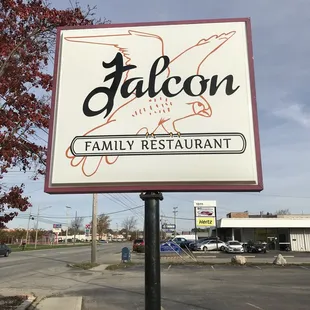 a sign for falcon family restaurant