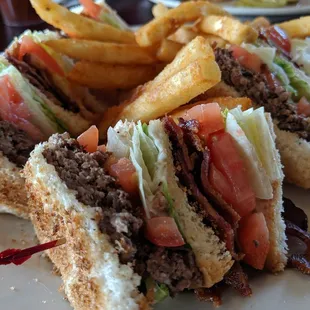 a plate of sandwiches and fries