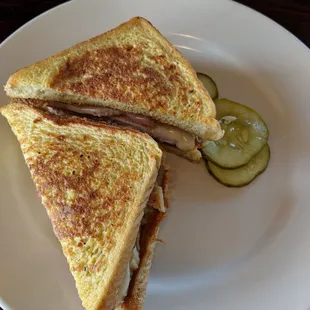 a grilled cheese sandwich with pickles