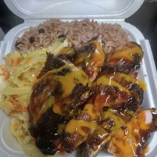 Rice and beans, steam Cabbage and Jerk Chicken