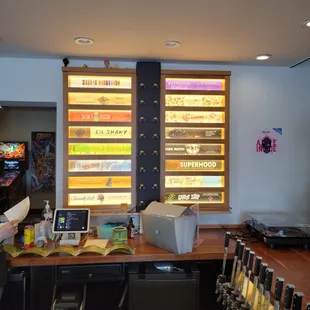 a bar with a variety of beer taps