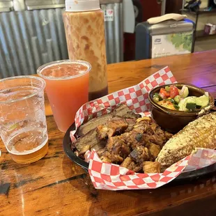 Brisket, pork belly, Mexican street corn, cucumber tomato salad and beeeer