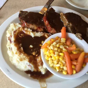 Huge plate of food. Homemade meat loaf and real mashed potatoes. Delicious!