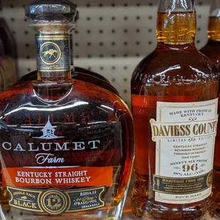 a variety of bottles of whiskey