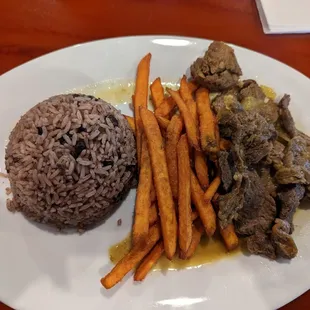 Bistec encebollado, ribeye steak, rice and sweet potato fries