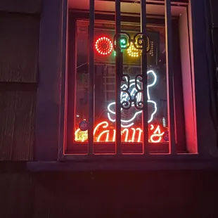 a neon sign in a window