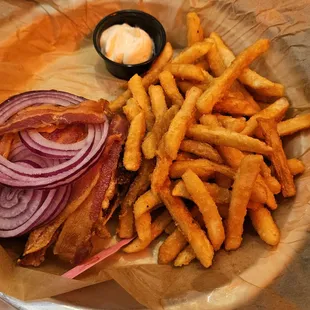 Fallston BYO Burger with fresh onions, cheese, bacon, fried egg, mayo and fries.
