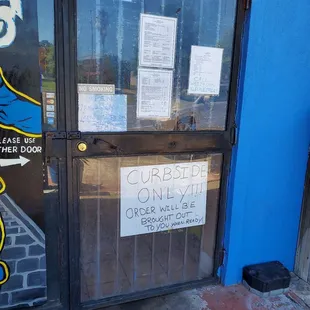 a closed door with a sign on it
