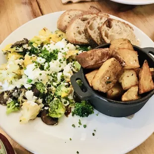 Veggie scramble with house potatoes and sourdough.