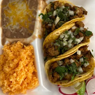 3 chicken soft tacos, rice and beans.