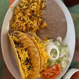 Taco , rice beans and salad