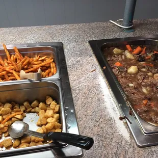 Seasoned fries, fried cubed potatoes, and beef stew