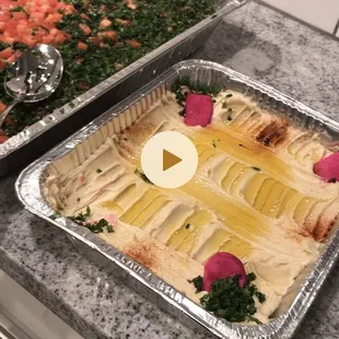 two pans of food on a counter
