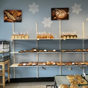 More fresh baked goods on shelves against the wall.