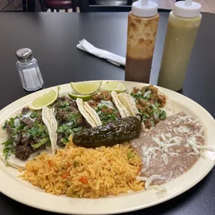 2 asada taco, 2 al pastor tacos, rice &amp; beans.