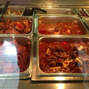 a variety of dishes in a buffet