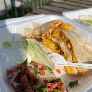 a chicken quesadilla and salad