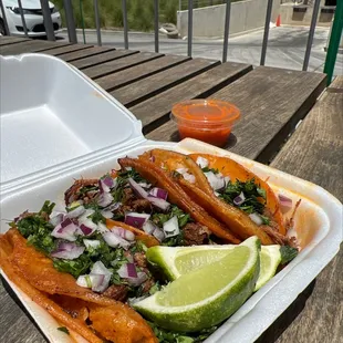 a tray of food on a picnic table