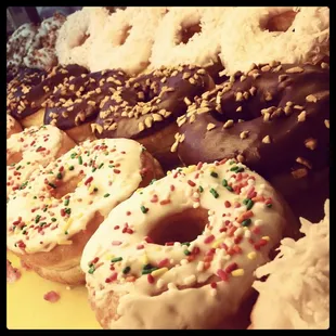 a variety of donuts with sprinkles