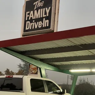 a truck parked in front of a gas station