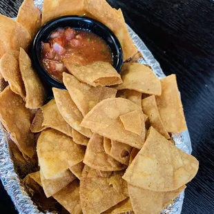 Homemade tortilla chips and house salsa