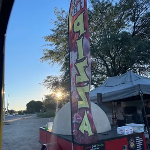 a pizza truck with a pizza on it