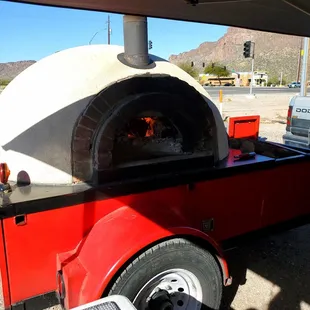 a pizza oven in a trailer