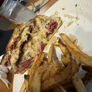 Ruben with "corned beef stacked to the sky"