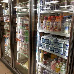 refrigerators filled with dairy and yogurt
