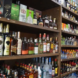 shelves full of alcohol and liquor