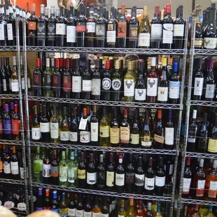 a variety of wine bottles on shelves