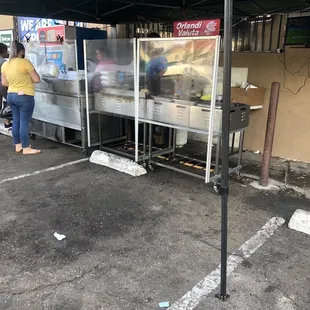 people standing under a tent