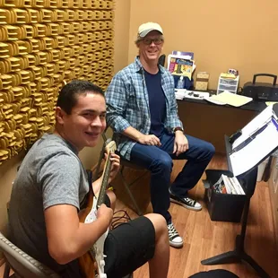 Bill and a student shredding on the guitar.