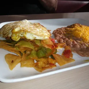 Special request of leos migas with over meduim egg on the side best mexican dish you can have with plenty others on the menu