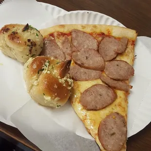 $2.75 for a slice + $1 for topping + .50 cents for garlic knots =$4.25