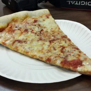 Plain slice, $2.50. Crisp, totally respectable.