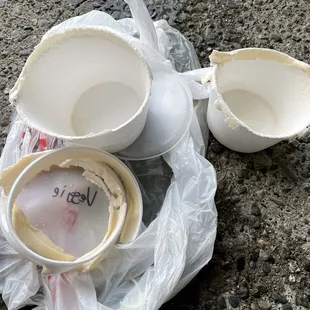 two empty cups and a plastic bag