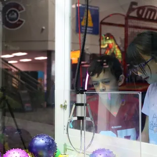 Try winning a prize from the claw machine.