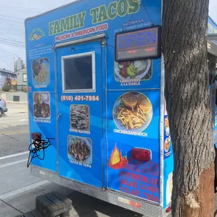 End of kiosk with "open" sign at right top