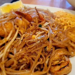 a plate of noodles and shrimp