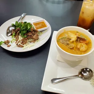 Thai tea with cream, tiger cry beef and Panang curry with combo meat.