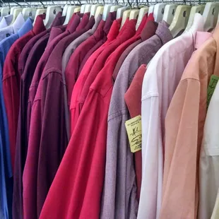 Shirts are organized by color and size for easy shopping