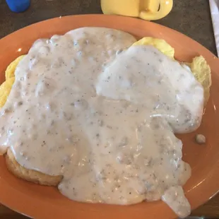 Half order of biscuits &amp; gravy with a side of scrambled eggs underneath. Amazing! And huge!