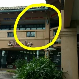 Clinic is on the second floor above The Barbershop.